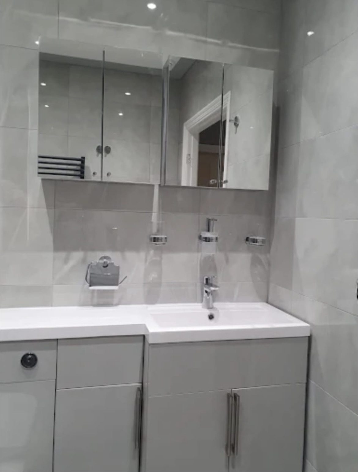 Modern bathroom suite with fitted furniture